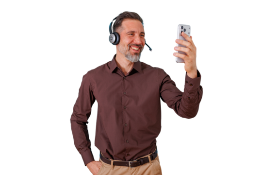Mature man wearing headset and talking on smartphone during a video call or online meeting, transparent background - Powered by Adobe