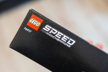 Naklejka premium Warsaw, Poland - Dec 16, 2025: Close-up of a LEGO Speed Champions box featuring the logo and model number 76917, showcasing the popular LEGO racing theme suitable for children and collectors.