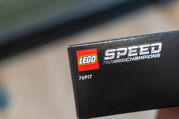 Naklejka premium Warsaw, Poland - Dec 16, 2025: Close-up of Lego Speed Champions box featuring brand logo and product number. Ideal for editorial use, showcasing creativity and play.