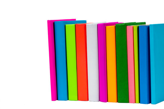 Books in multi-colored covers on an isolated background. Literature for children. Collection in the library. Textbooks for school college or university
