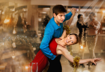 Adult woman and young man dancing in dance class
