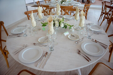 elegant banquet tables prepared for a conference or a party indoors