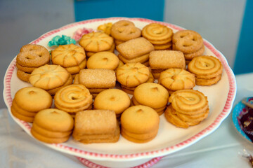 butter cookies on white plate with pink details