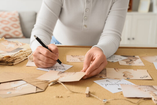 Woman making family tree at home