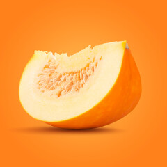 Piece of pumpkin on orange background. Gourd vegetable