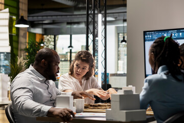 Real estate developers gather to present master plans for apartment construction project,...