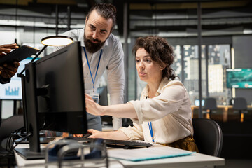 Professional colleagues team analyzing online graphs and resource allocation, demonstrating engagement and synergy between coworkers as they prepare performance reports. Networking.