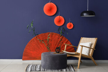 Interior of living room with armchair, ottoman and decor for Japanese New Year celebration