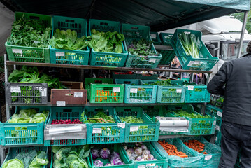 Open air farmers market with fresh produce stalls