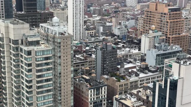 Day scene of top view of New York City Manhattan street with traffic and skyscrapers around