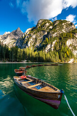 Obraz premium Serene Boats at Lago di Braies in the Heart of the Italian Alps