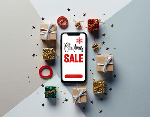 Smartphone with &ldquo;Christmas Sale&rdquo; ad in flat lay with gifts, confetti and ribbons on white background