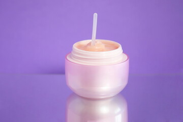 Pink cosmetic jar, face cream, skin care product, beauty product