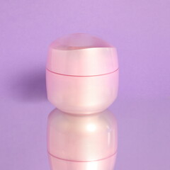Pink cosmetic jar, face cream, skin care product, beauty product