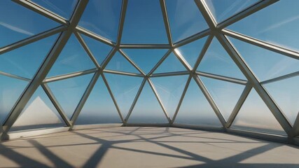 Inside a modern architectural geodesic dome with glass panels.