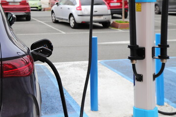 Electric car charge station, eco friendly recharge on parking