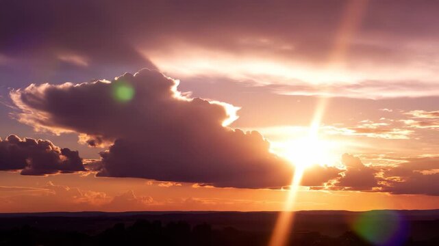 The vibrant sunset casts warm colors across the sky as fluffy clouds float gracefully. This beautiful sunset creates a serene atmosphere, inviting viewers to reflect on nature's wo