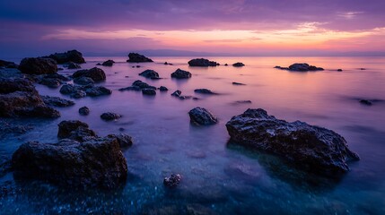 Obraz premium Rocks in Water at Beautiful Purple and Pink Sunset