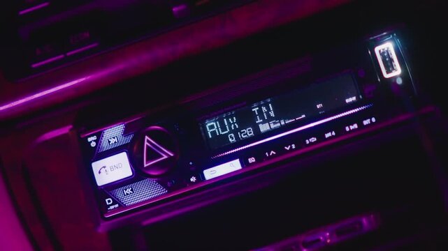neon car stereo display glowing with magenta equalizer, buttons and knobs illuminated, LCD text and icons visible, retro synthwave mood, night drive soundtrack, playlist control, closeup console,