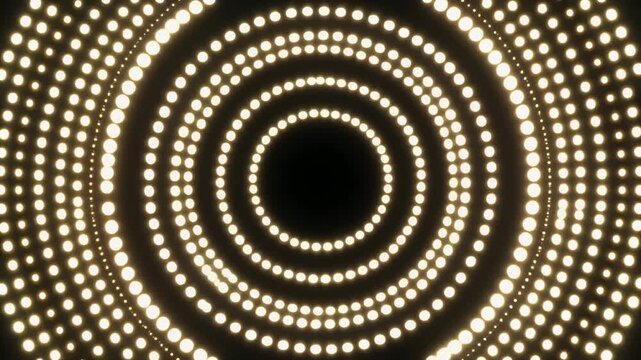 Abstract glowing dots tunnel animation with vibrant concentric circles creating a dynamic and energetic light effect perfect for backgrounds and intros