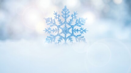 A Close-Up Macro Shot of a Delicate Blue Snowflake on a Soft Snowy Background.