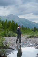 Man enjoys hiking adventure trip in Denali national Park