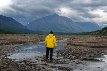 Man enjoys hiking adventure trip in Denali national Park