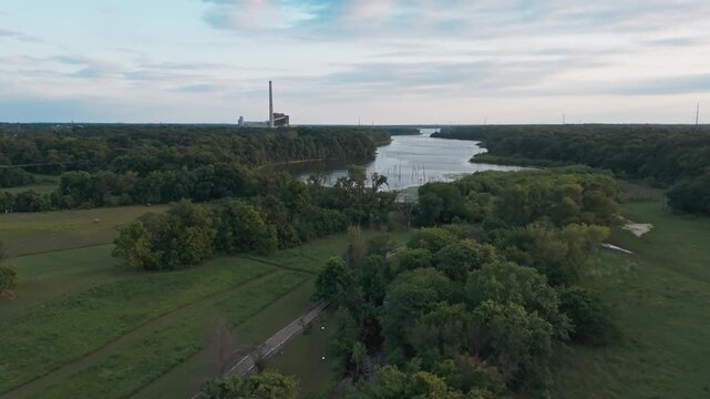 Aerial wide overview approach to Flint Creek Power Plant and Swepco lake, cloudy overcast sky