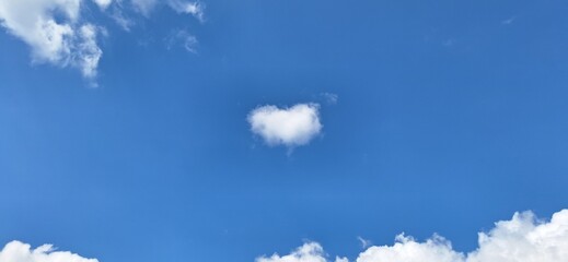 Heart shaped cloud on blue sky background for love and hope concept