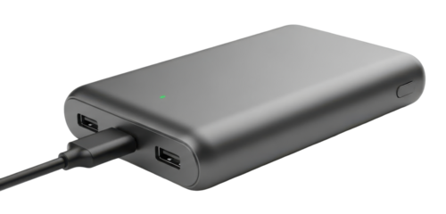A close-up shot of a sleek, gray power bank with a charging cable plugged in, isolated on a white background.