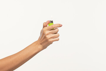 A woman's palm with a green lighter on a white background