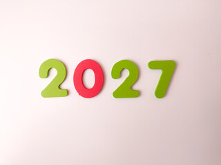 The image displays the number 2027 in multicolored numbers on a white background