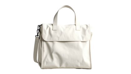 Cream-colored tote bag with a flap closure, handles, and a shoulder strap, on black background