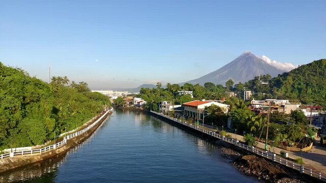Mayon Volcano offers a beautiful view overlooking Legazpi City and the boulevard bridge in Legazpi City, Albay, Philippines.