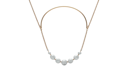 A gold necklace with a curved design, showcasing a string of white pearls