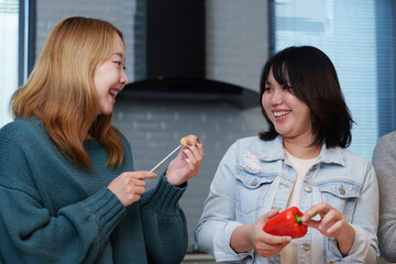 Cooking Party: Friends Enjoying Fun Cooking Session with Fresh Ingredients