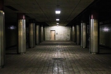 Echoes of Silence: A Dimly Lit Industrial Underground Corridor © Bossa Art
