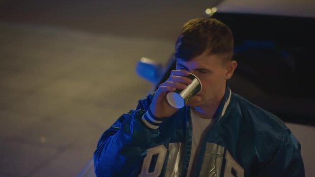 Driver gazes afar, White male driver looks into distance, Cool cinematic scene featuring reflective male driver, Quiet plaza setting with male driver holding paper cup and contemplating