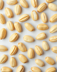 Obraz premium Golden Yellow Seeds on Light Background for Culinary and Nutritional Use