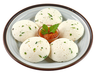 South indian idli with sambar and parsley garnish on a decorative plate
