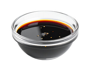 Soy sauce in glass bowl with pepper flakes, isolated on white