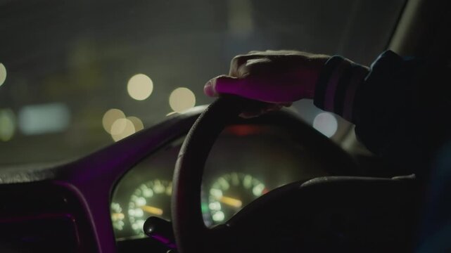 night steering wheel closeup white driver nervous hand grips wheel under neon city bokeh, dashboard gauges glowing, purple ambient light, roles latenight taxi driver, rideshare courier, city