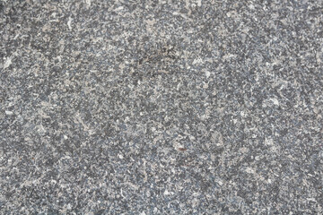 A full frame, closeup of a fine-grained speckled texture, resembling granite, concrete, or stone composite.
