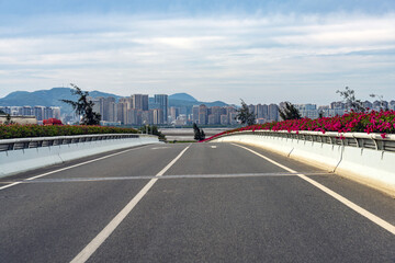 Urban Highway with City Skyline in Distance