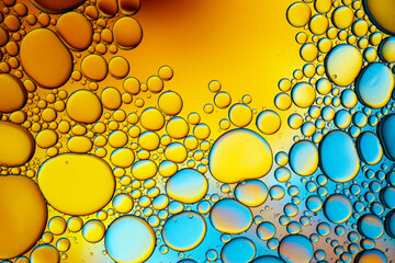 Close up of oil drops on water surface. Colorful abstract macro background of oil drops on water surface with air bubbles inside. Colorful background for gadget and computer wallpaper