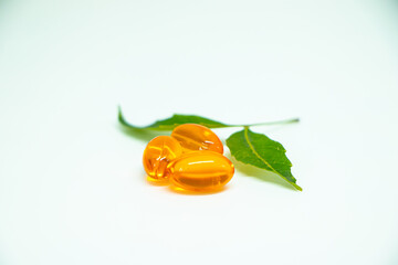 Vitamin e capsule or fish oil capsule isolated on white background.