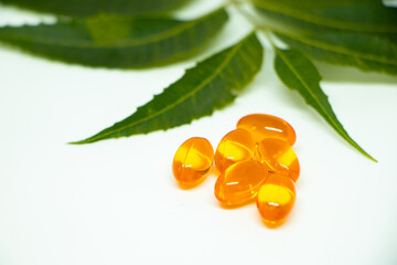 Healthcare concept. Vitamin e capsule isolated on white with medicine background.