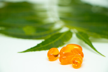 Healthcare concept. Vitamin e capsule isolated on white with medicine background.