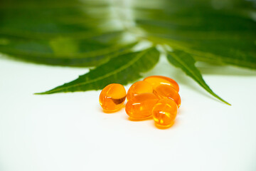 Healthcare concept. Vitamin e capsule isolated on white with medicine background.