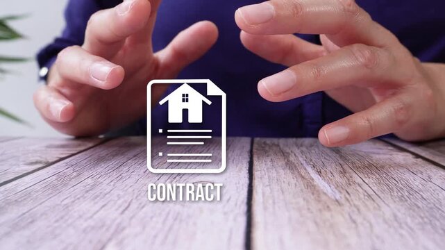 Close-up of hands protecting a real estate contract icon with the text "Contract", on a wooden table